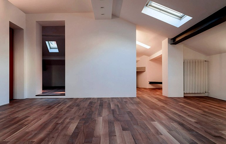 Room in a modern apartment focusing on the clean sanded wooden floor